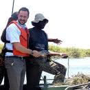 Crown Prince Haakon fishing with local fishermen in the Okavango delta (Photo: Ida Fjeldbraaten, The Royal Court)
